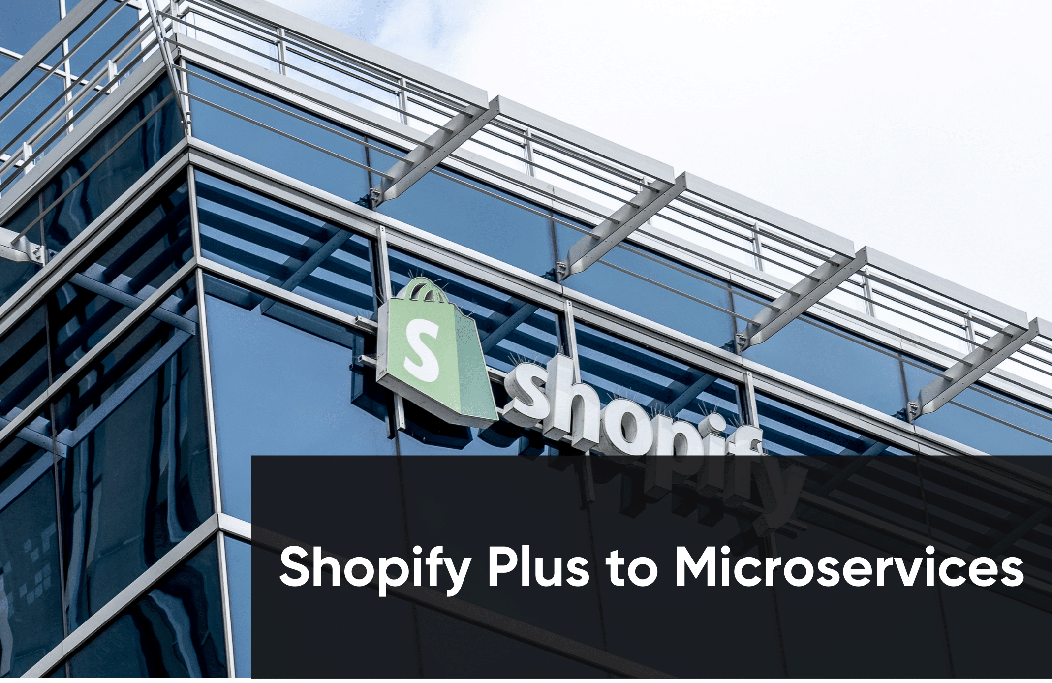 A modern glass building with a mostly obscured Shopify logo. A black overlay reads "Shopify Plus to Microservices" in white text.